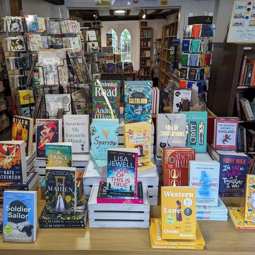 The front of the shop: a display table with new hardback and paperback books