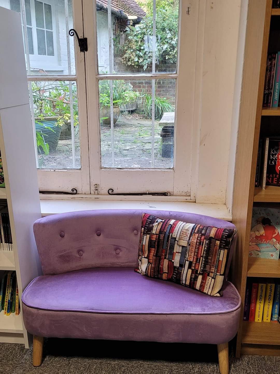 A child-size sofa in front of the garden window at the rear of The Crow Road